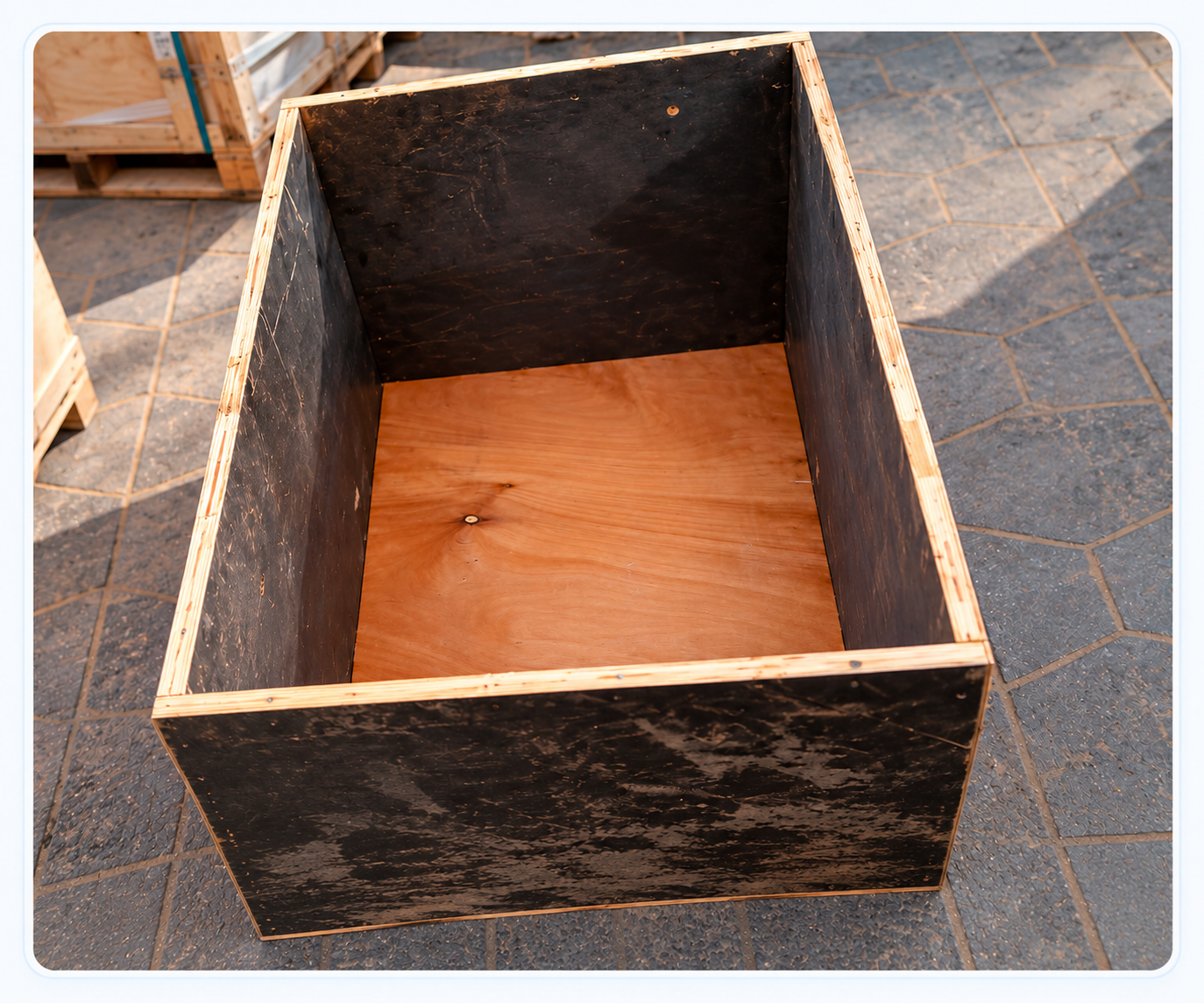 Interior of an empty wooden cargo crate used for furniture shipping from Deira, Dubai, to Lahore, Pakistan.